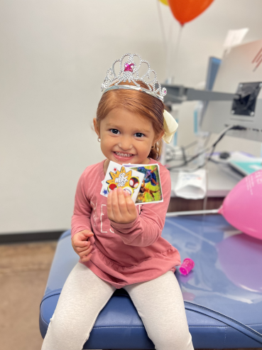 Caring for Dental Crowns Happy Triad Patient with Prizes
